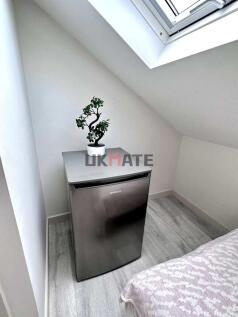 A bright and modern kitchen area featuring a co...