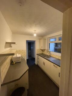 A functional kitchenette featuring ample storag...