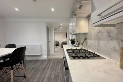 A modern and clean kitchenette featuring stylis...