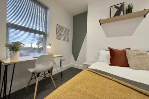 A stylish and inviting double bedroom featuring...