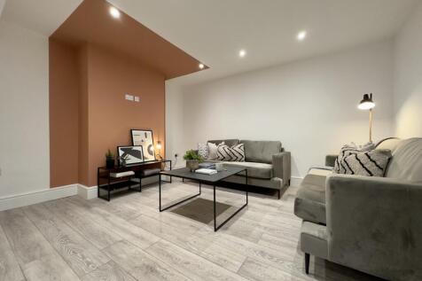 A stylish and spacious modern living room perfe...
