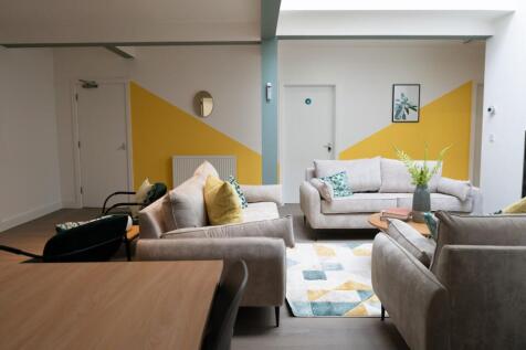 A spacious and stylish modern living room, perf...