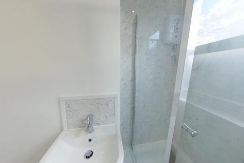 A bright and modern bathroom featuring a sleek ...