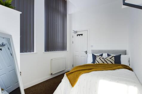 A stylish and bright double bedroom featuring l...