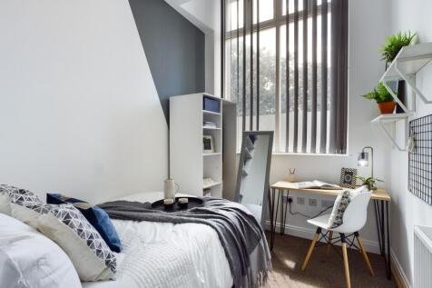 A bright and inviting double bedroom featuring ...