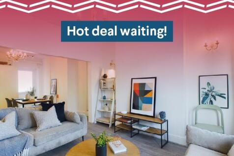 A modern and inviting living room with comforta...