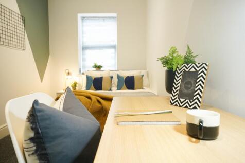 A well-lit, modern living room equipped with st...