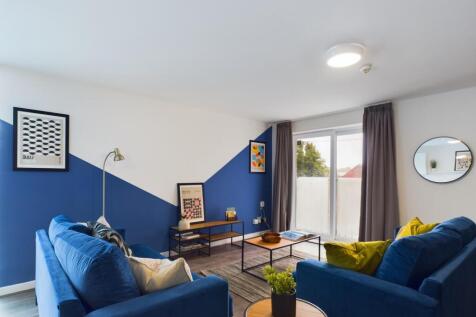 A modern and inviting living room featuring sty...