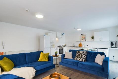 A bright and inviting living room featuring mod...