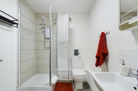 Bright and modern bathroom with a spacious show...