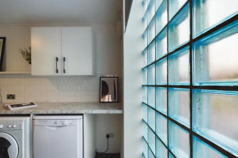 A bright and modern kitchen with ample natural ...