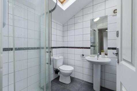 A bright and modern bathroom featuring a spacio...