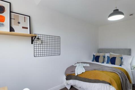 A stylish and inviting double bedroom featuring...