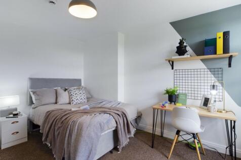 A bright and inviting double bedroom featuring ...