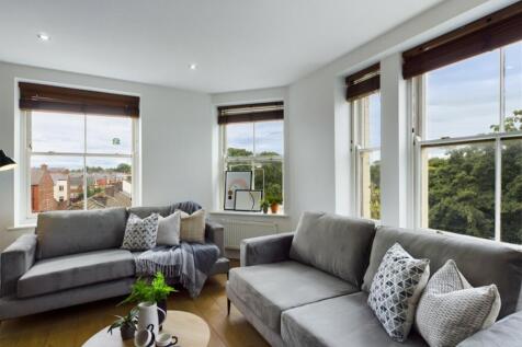 A spacious and stylish modern living room with ...