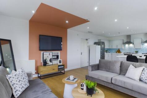 A spacious and inviting modern living room with...