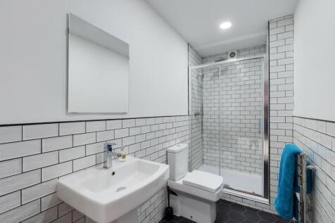 A modern, well-maintained bathroom with a spaci...