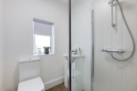 A modern and clean bathroom featuring a refresh...