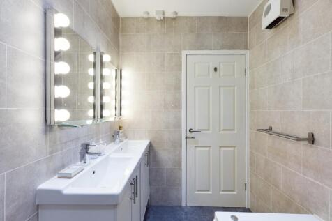 A bright and modern bathroom featuring stylish ...