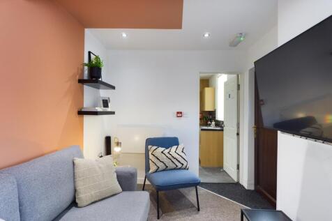 A cozy and inviting living room, perfect for re...