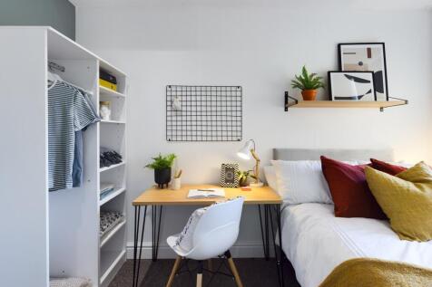 A bright and inviting double bedroom with moder...