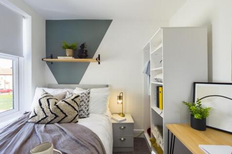 A stylish and inviting double bedroom with ampl...