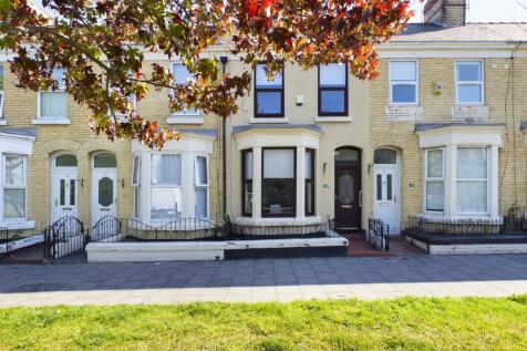 A charming exterior view of the property with w...