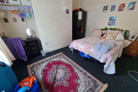 A spacious and well-maintained master bedroom f...