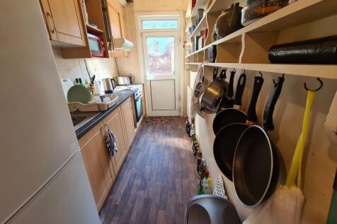 A bright and well-organized kitchen area with a...