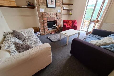 A spacious and inviting living room featuring c...