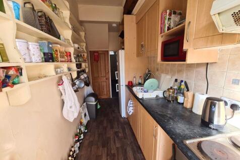 A well-equipped kitchen with a clean, modern co...