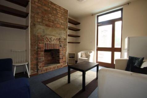 Bright and welcoming living room featuring larg...