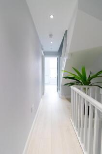 A bright and clean hallway featuring modern des...