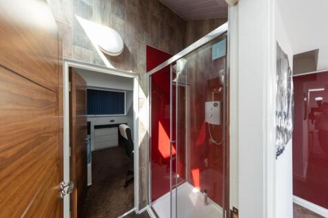 Bright and modern bathroom featuring a spacious...