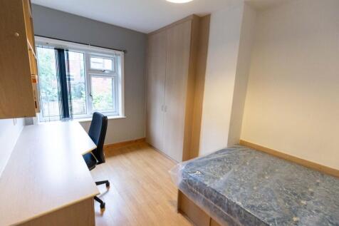 A bright, well-maintained bedroom featuring a s...