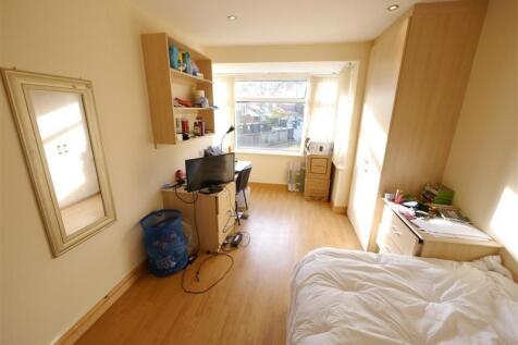 Bright and comfortable master bedroom featuring...