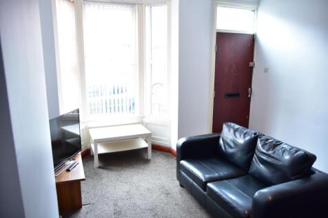 A bright and inviting living room featuring a l...