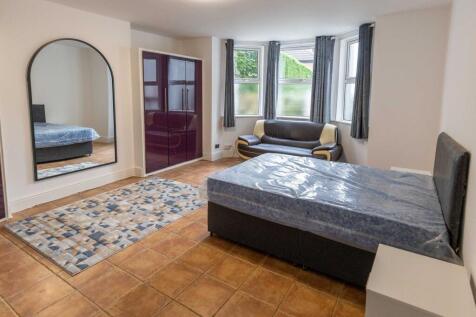 Bright and welcoming living room featuring larg...
