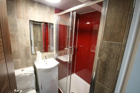A modern bathroom featuring a shower cubicle wi...