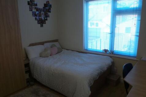 A cozy bedroom featuring a double bed with deco...