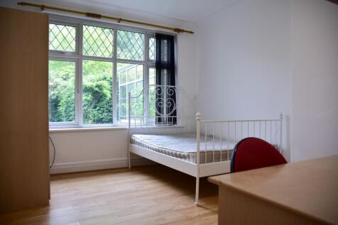 Bright and airy bedroom with large window views...