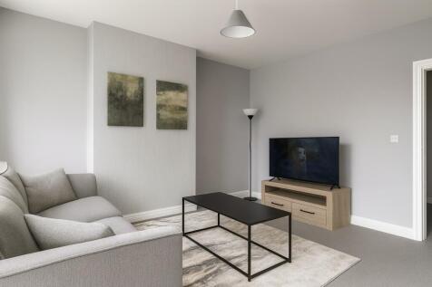 A modern and bright living room featuring a com...
