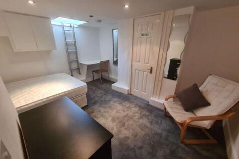 A clean and well-maintained toilet room featuri...