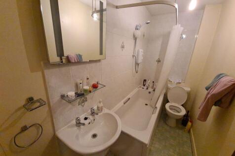A neat and functional bathroom suite featuring ...