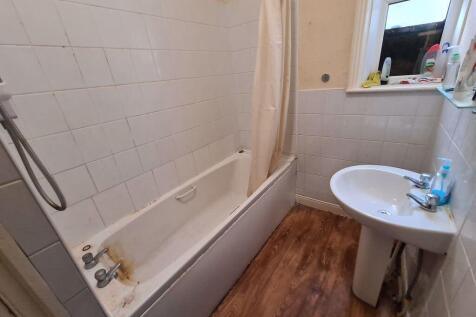 A clean and functional bathroom featuring a bat...