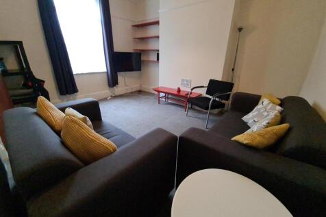 A modern and inviting living room featuring com...