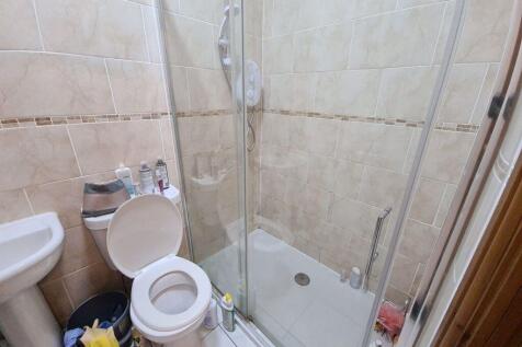 A well-maintained bathroom featuring a spacious...
