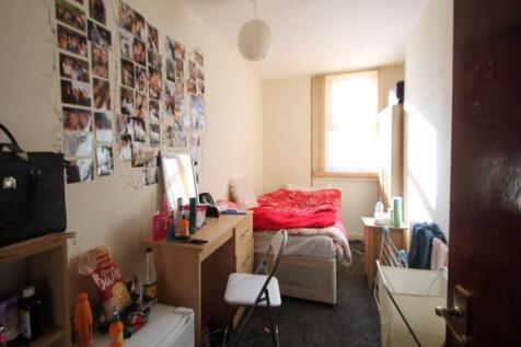 Cozy single bedroom with a bright window allowi...