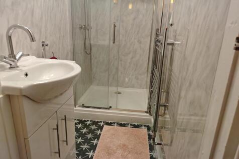 A modern, well-maintained bathroom featuring a ...