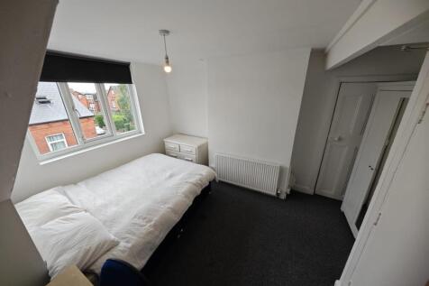 Bright and tidy double bedroom featuring a comf...
